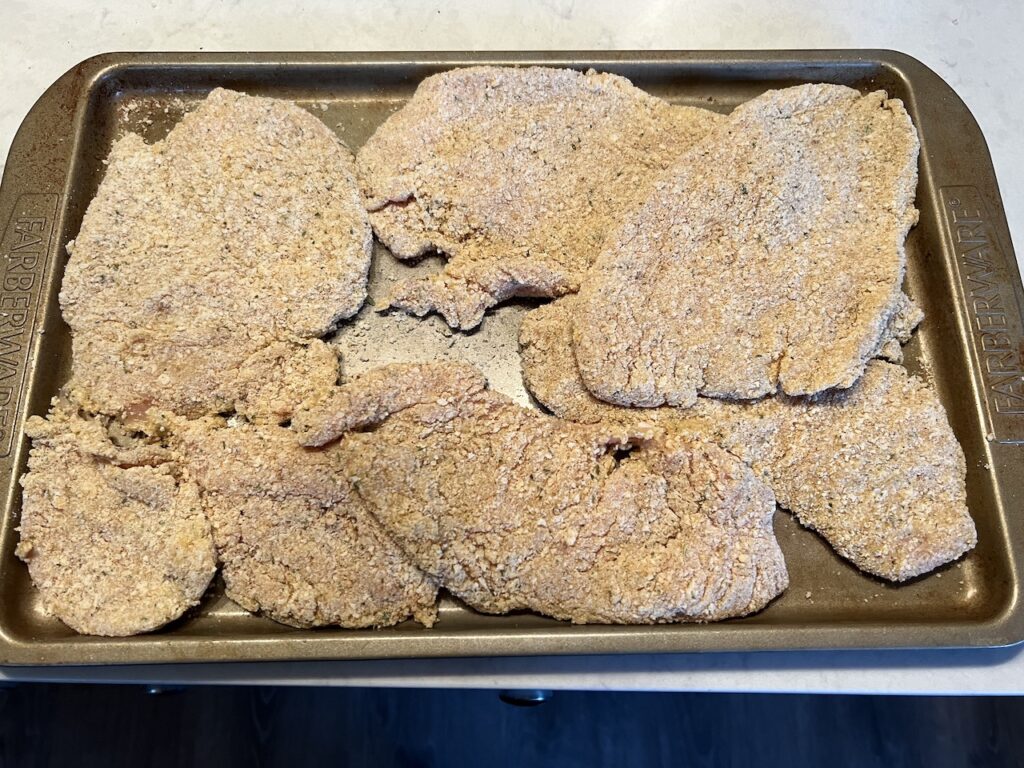 after breading, allow the chicken to sit for about 10 minutes before cooking.  this helps the breading adhere while frying.